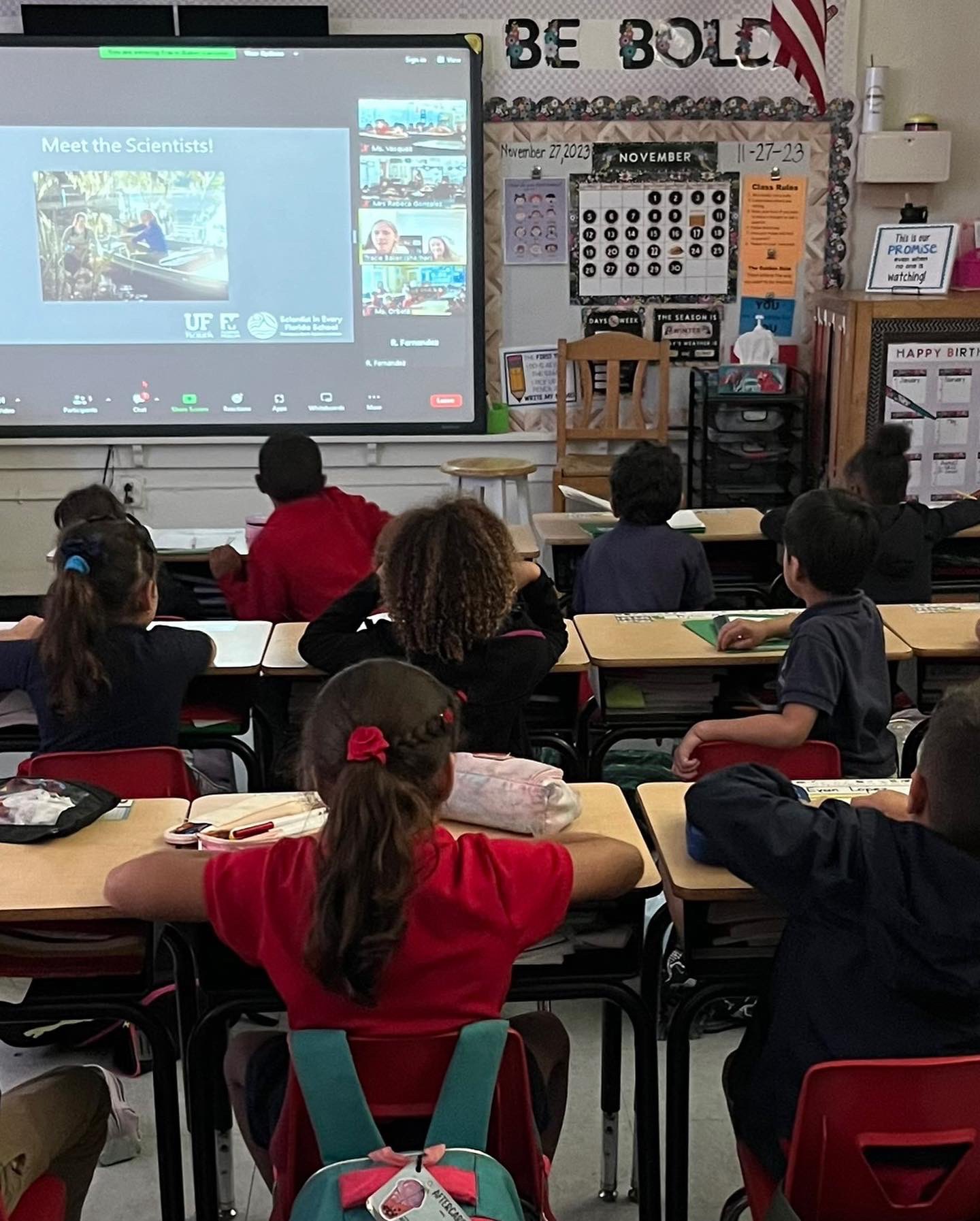 Dr. Tracie Baker chats with 1st grade students about water pollutants