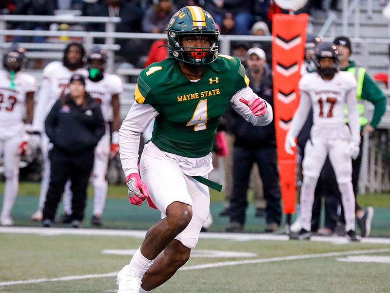 Carl Ware on football field during a game