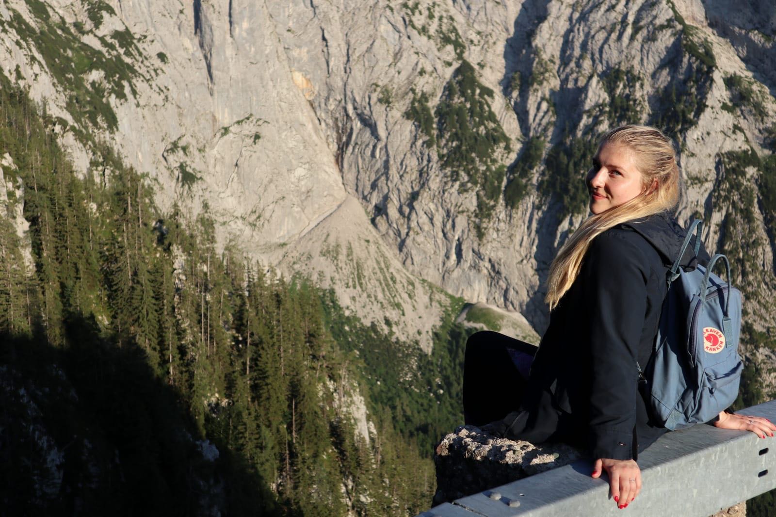 Kathe sitting on a mountain side in the Alps