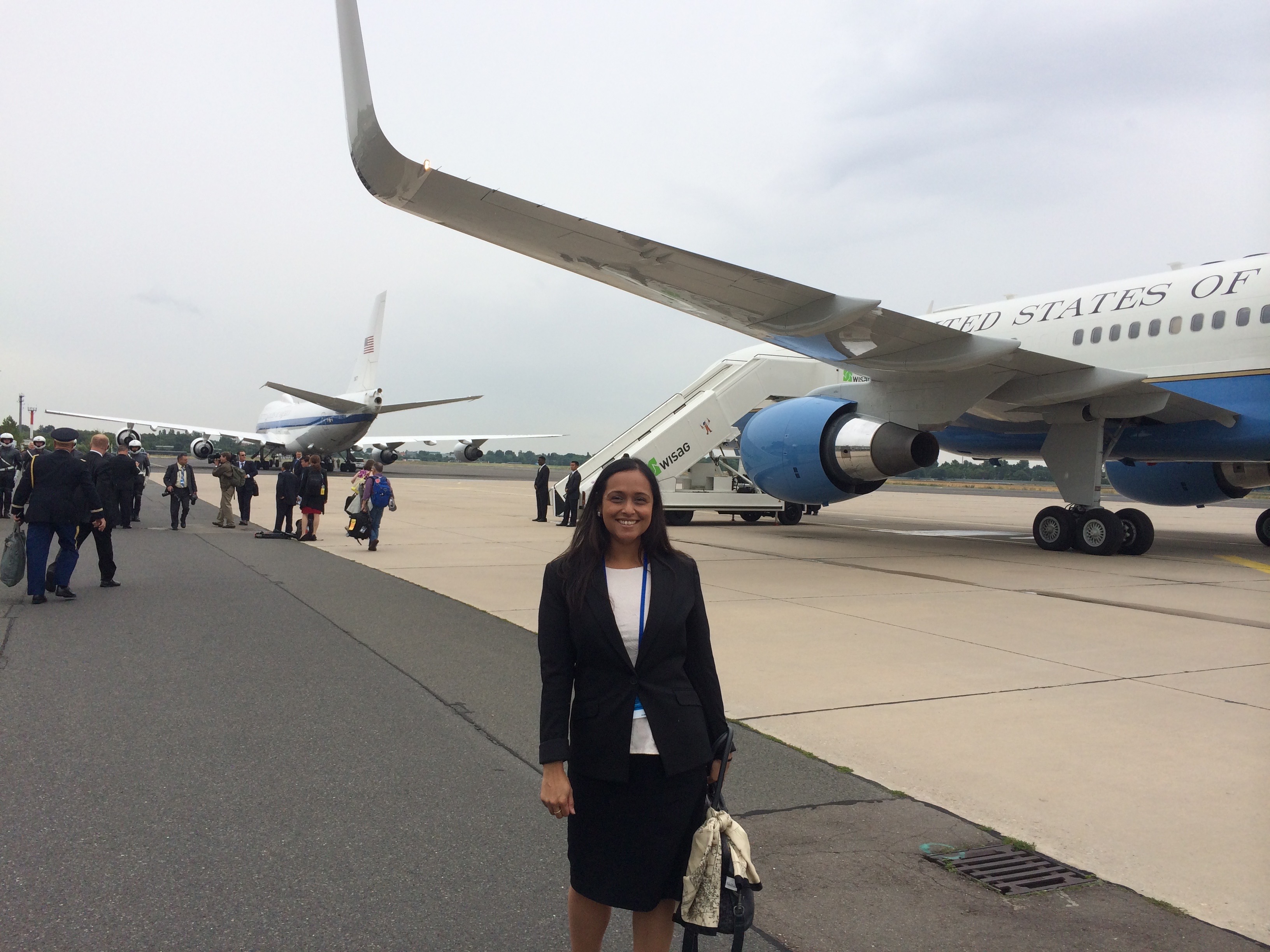 Maya in front of a plane